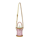 Pink spool bag with a beige strap on a white background