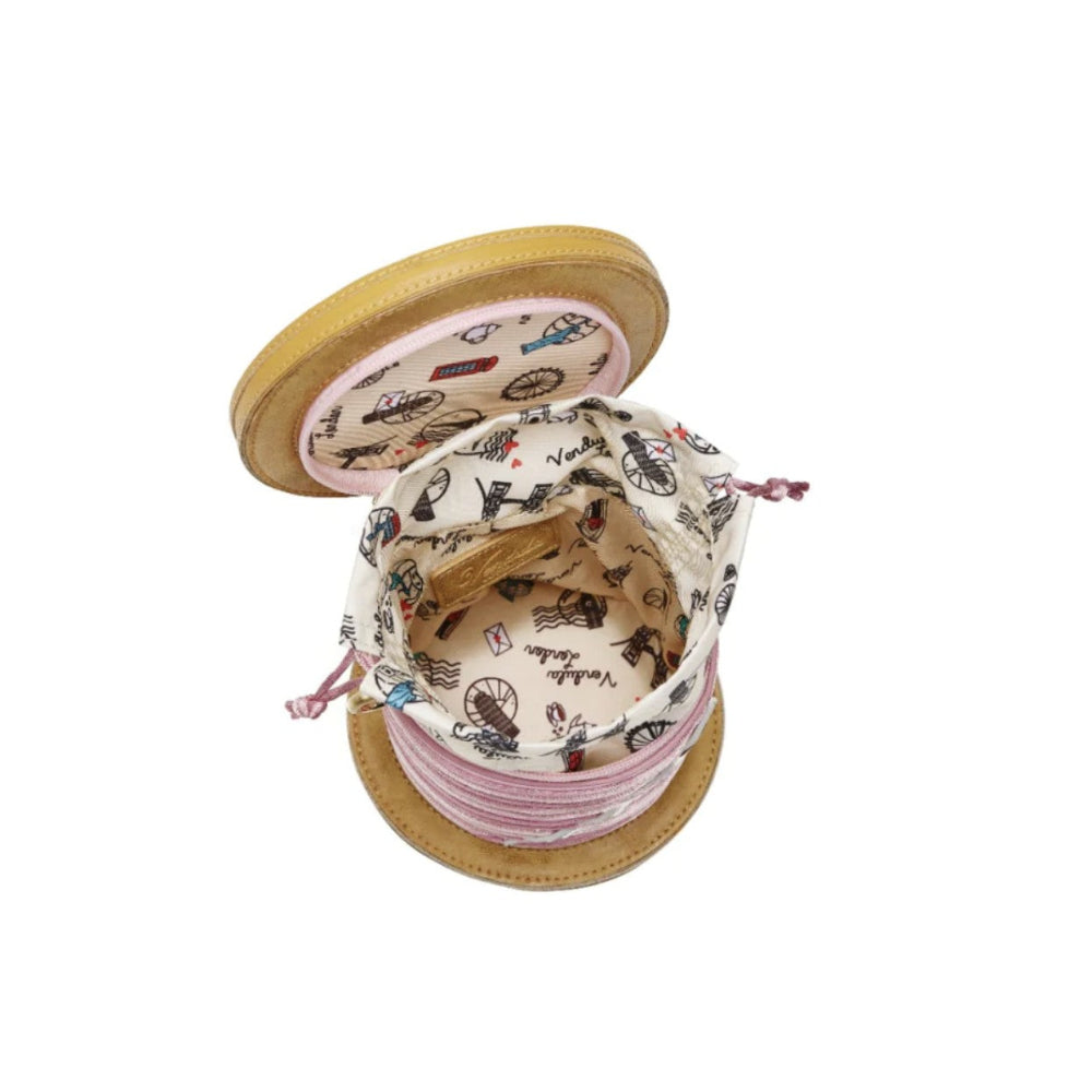 Spool of thread with a decorative top on a white background