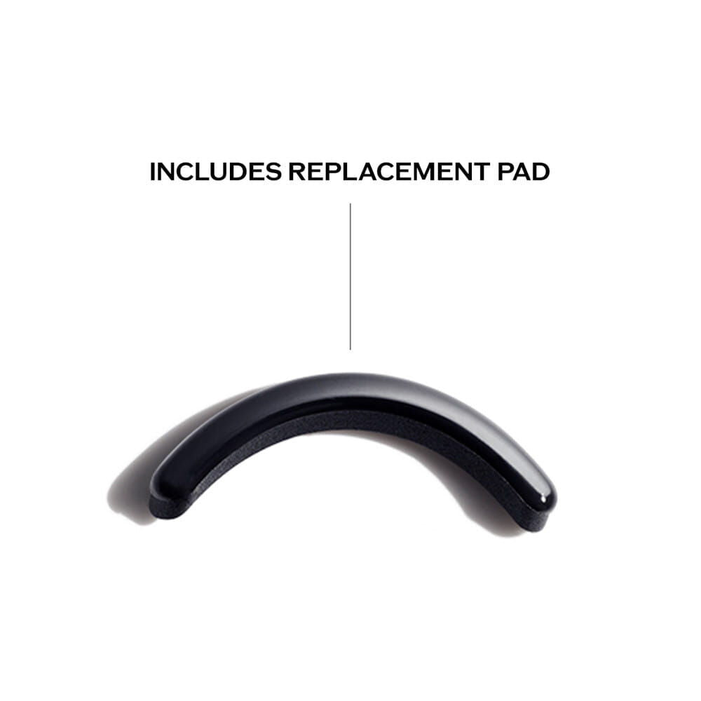 Black curved object with text 'INCLUDES REPLACEMENT PAD' on a white background