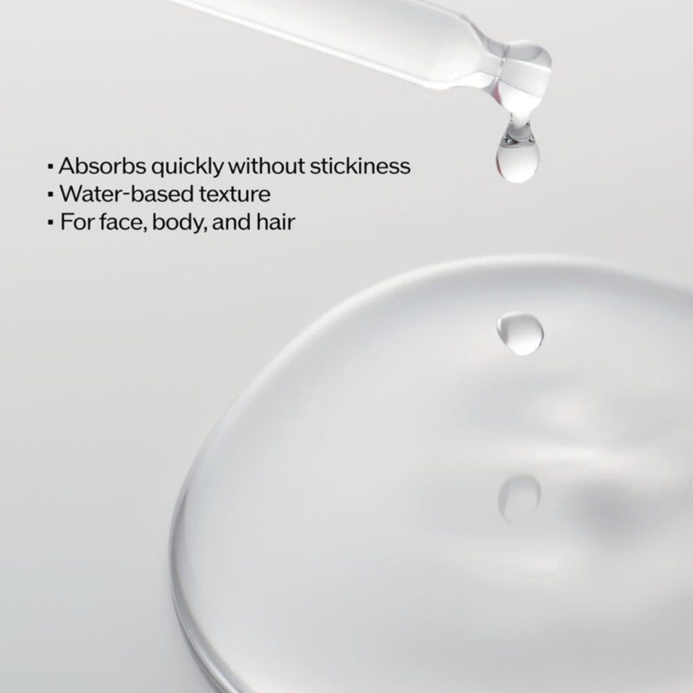 Close-up of a oil droplet being poured onto a white surface with text describing product features.