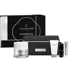 Shiseido Men Total Age Defense Programme Gift Set featuring a black and white presentation box, a black textured travel case, a clear jar with a white lid, a white tube, a black bottle, and a silver tube, displayed on a white background.