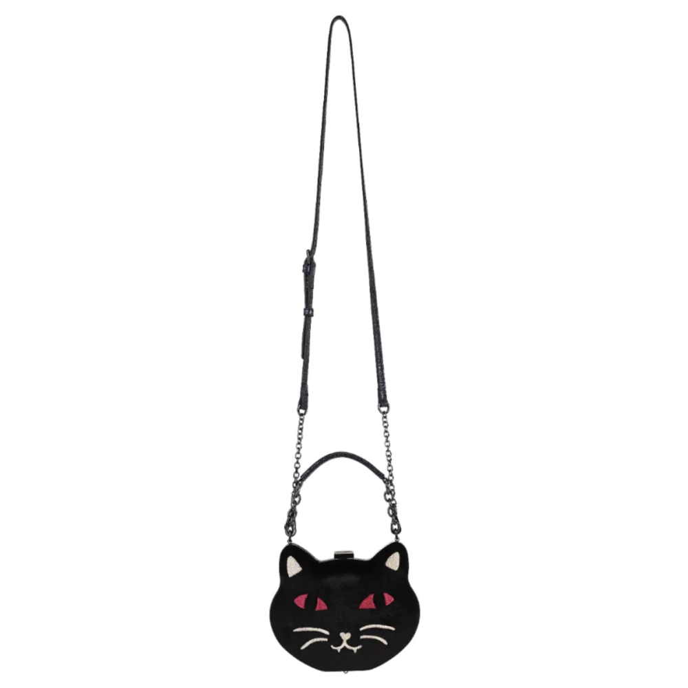 A black cat-shaped crossbody bag with embroidered pink eyes, white whiskers, and a long black strap with silver chain links, shown against a plain white background.