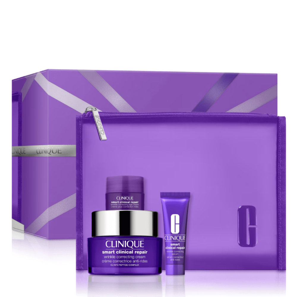 Clinique Smart Clinical Repair gift set featuring a purple cosmetic pouch, a purple jar with a silver lid, and a purple tube, displayed in front of a matching purple gift box on a white background.