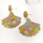 flower design earrings in mustard background and colourful flowers
