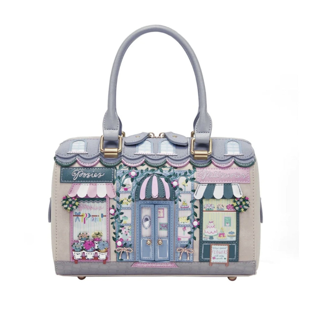 Handbag with a design of shop fronts on a white background