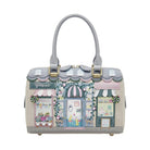 Handbag with a decorative design of a quaint street scene on a white background