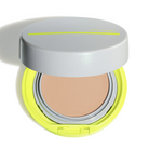 An open round cushion foundation compact with a light gray lid, a bright neon yellow-green base, and a beige pressed powder foundation pan visible inside, shown on a white background with a soft shadow.
