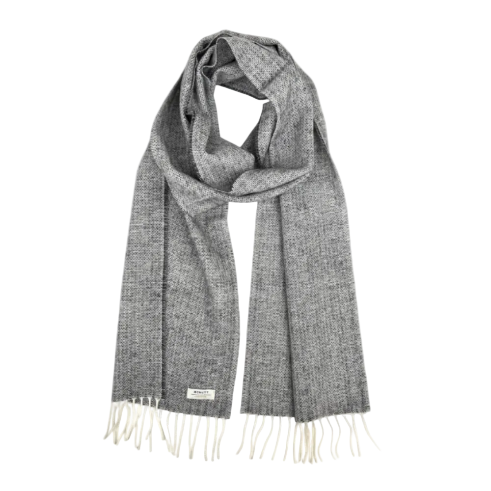 A gray and white heathered knit scarf with cream-colored fringe ends and a small white brand label near the bottom left, displayed on a solid white background.