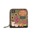 A small zip-around wallet with a floral patchwork design, featuring embroidered potted flowers and decorative signs that read 'Vendula Flower Shop' and 'Sunflower Festival'.