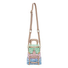 Pastel-colored handbag with a strap on a white background