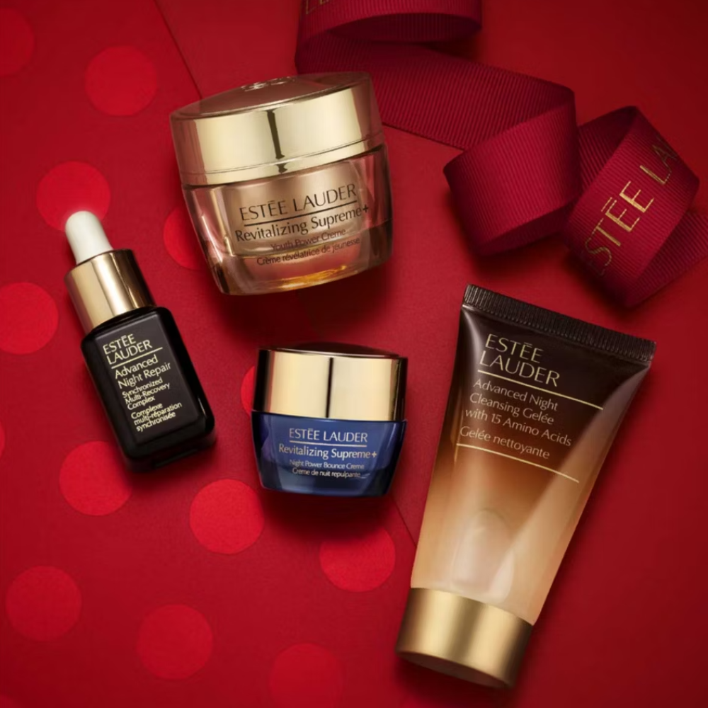 Estée Lauder skincare products on a red background