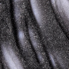Close-up of a textured black surface with speckles
