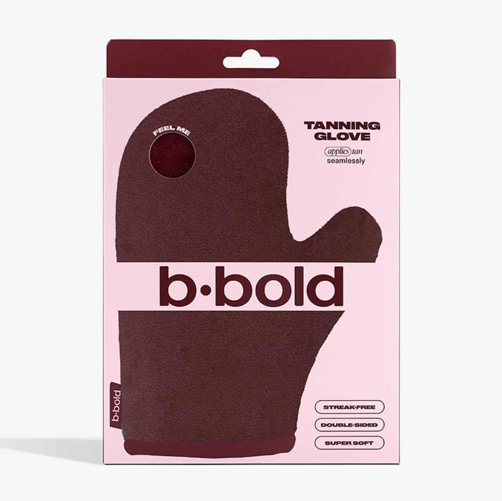 Tanning glove packaging with 'b•bold' branding on a pink background