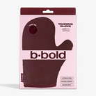 Tanning glove packaging with 'b•bold' branding on a pink background