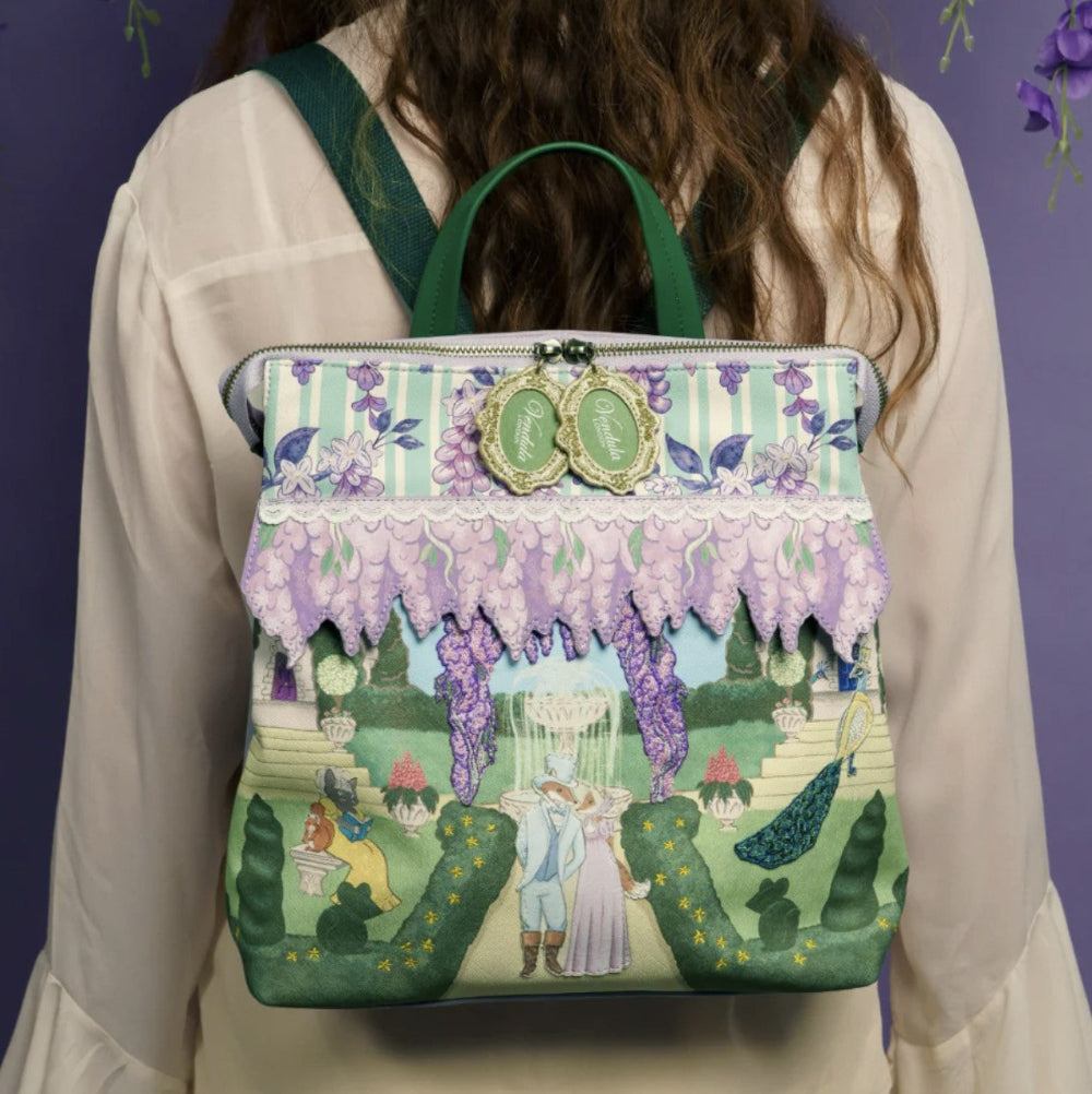Person wearing a colorful backpack with fairy tale design