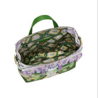 Green patterned bag with floral accents on a white background