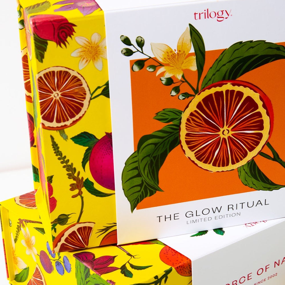 Packaging with colorful designs and 'trilogy' branding on a white background