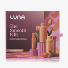 LUNA The Smooth Edit haircare set in its retail box, featuring three full-size bottles and a tube of smoothing products against a pink and orange floral background.