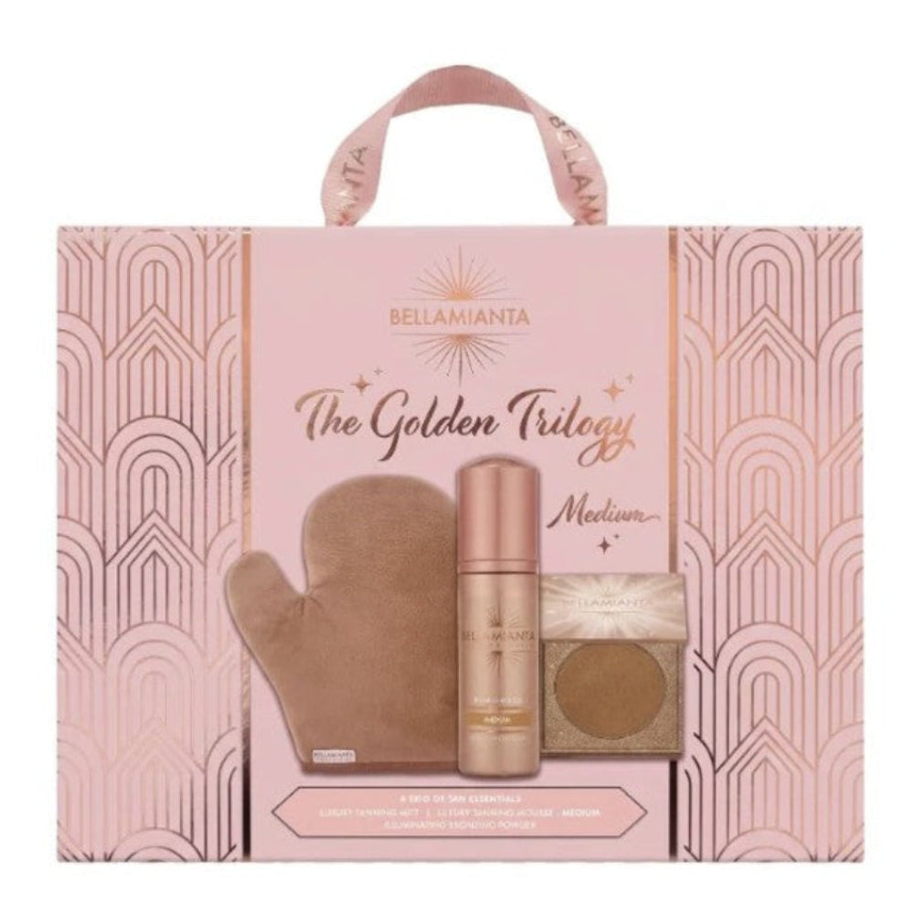 Bellamianta The Golden Trilogy Medium tanning set in a pink gift box with a handle, containing a beige tan bottle, a rose gold spray bottle, and a small square compact.