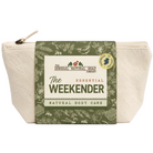 A canvas zippered pouch with a green and cream paper band label reading 'The Weekender Natural Body Care' by The Donegal Natural Soap Company, shown on a white background.
