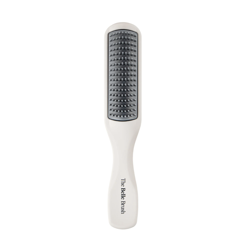 White brush with black bristle head on a white background