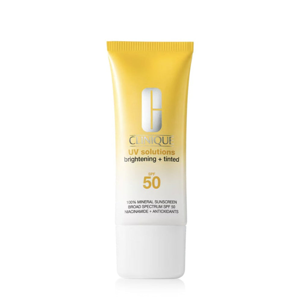 Clinique UV Solutions Brightening + Tinted SPF 50 sunscreen tube, featuring a yellow-to-white gradient design with gold lettering.