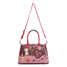 A pink and mauve tote handbag with a long shoulder strap, featuring a whimsical patchwork design with sewing and craft motifs on a white background.