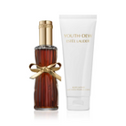 Estée Lauder Youth-Dew perfume bottle and body lotion on a white background