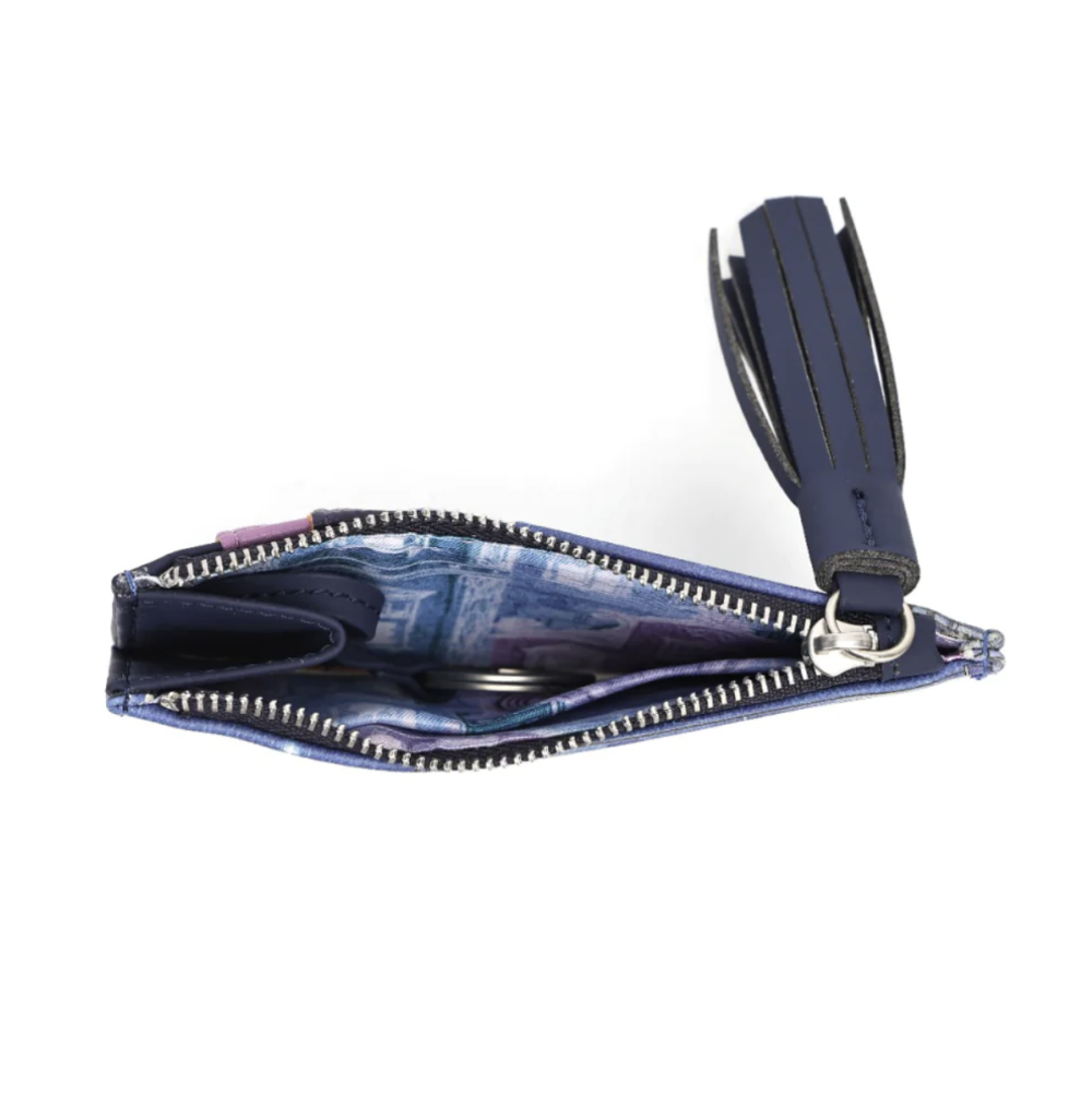 A small zippered coin purse with a navy blue leather tassel strap and silver zipper, shown open against a plain white background.